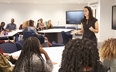 giving lecture to group